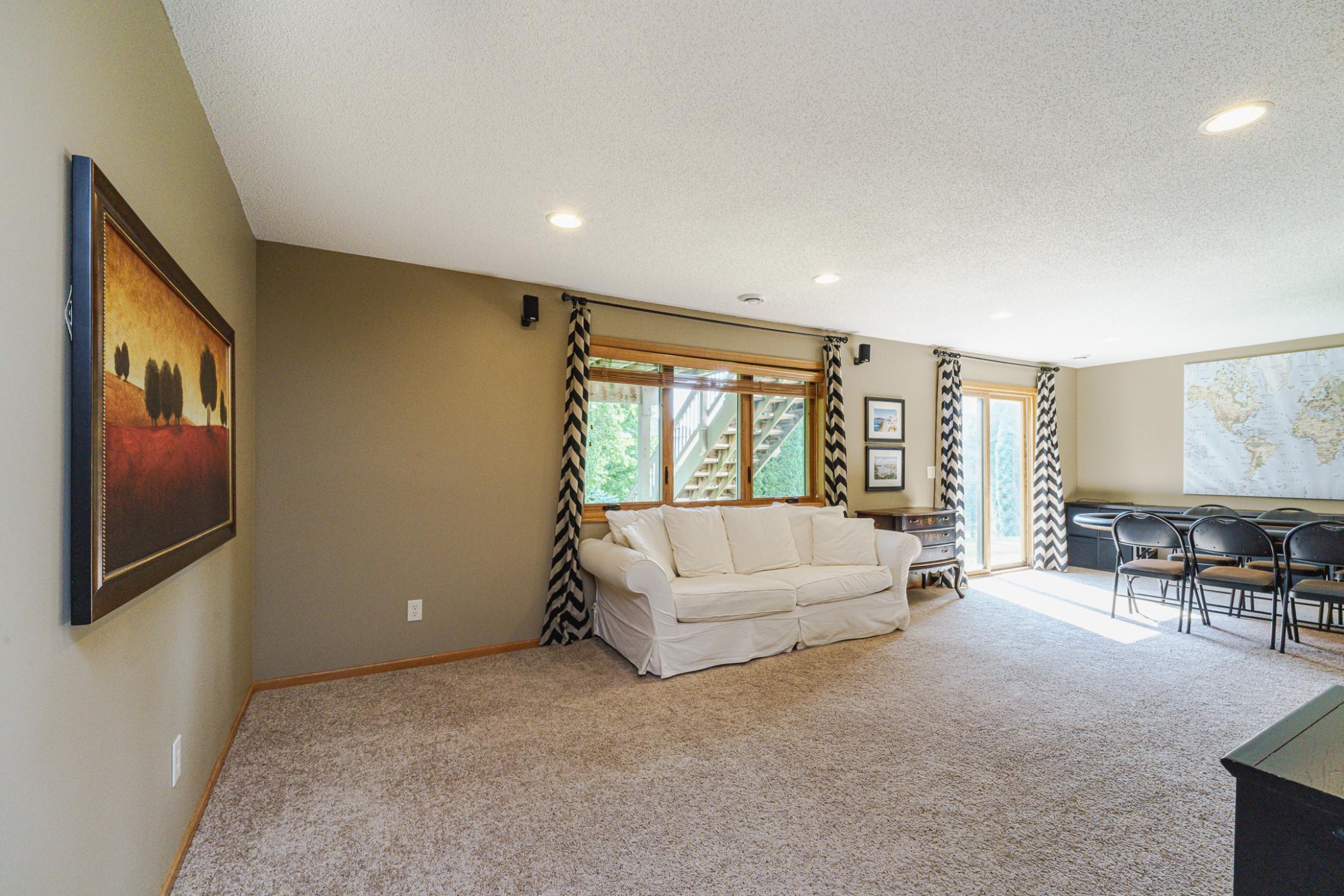 The family room has 9-foot ceilings with surround sound speakers, recessed lighting, and full-sized daylight windows.