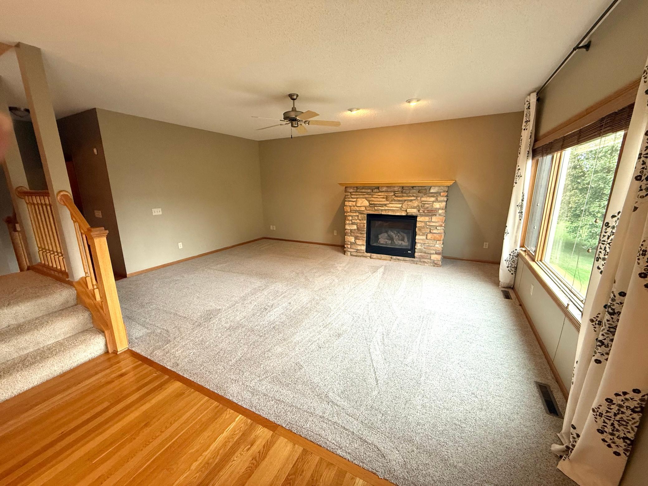 Main floor family room with updated carpet and gas fireplace!
