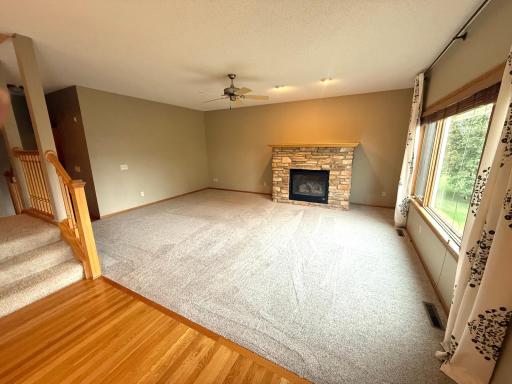 Main floor family room with updated carpet and gas fireplace!