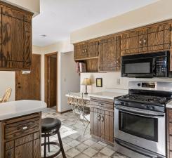 tons of cabinets, workspace b-fast bar