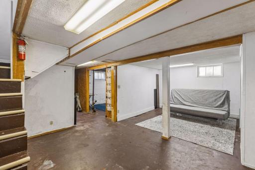 With finished walls and ceiling, and painted cement floors, this lower level family room is waiting for your touches to make it perfect.