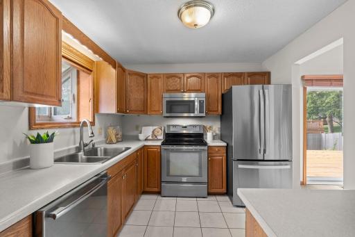 Stunning bright kitchen with stainless steel appliances.