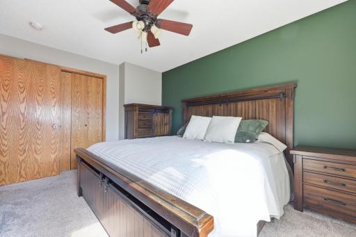 This angle of the primary suite showcases generous closet space