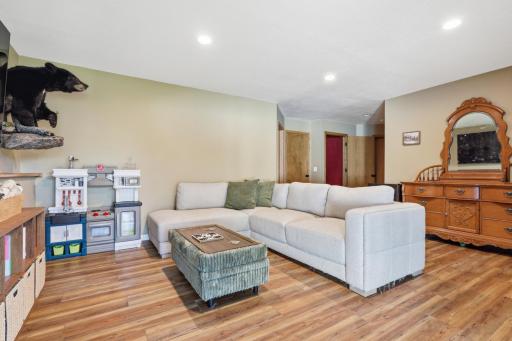 This flexible living space is an ideal spot for a second living area, playroom, or media room.