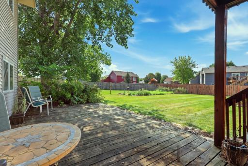This shaded lower-level deck offers a quiet retreat with room for a bistro table and chairs, right off the walkout level. Direct access to the spacious backyard makes it easy to enjoy the outdoors from either level of the home.