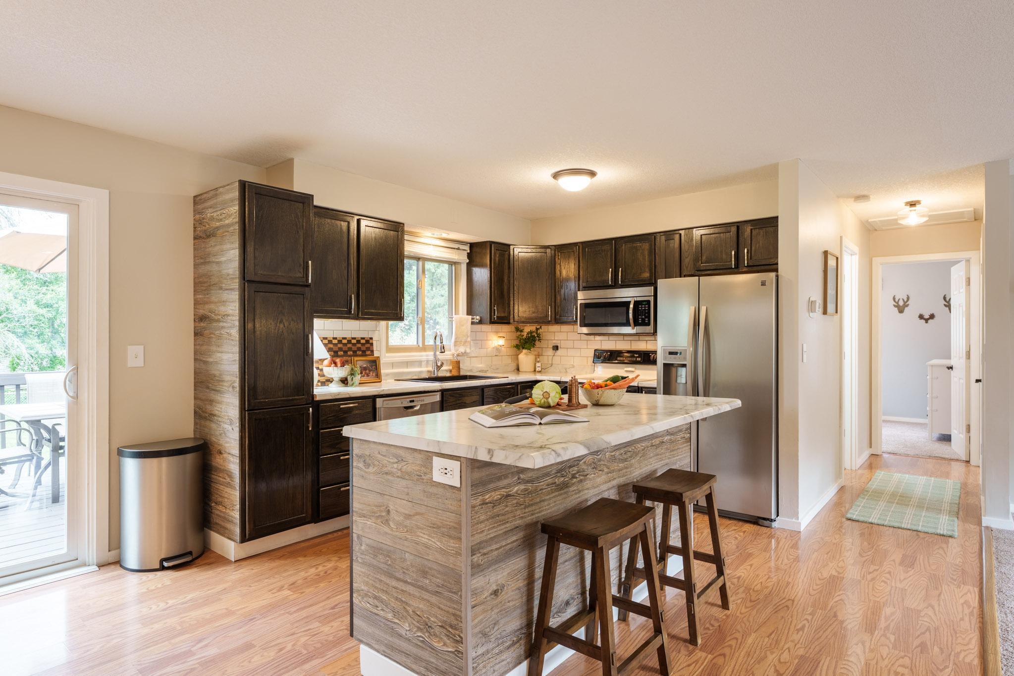 The main level offers a spacious, open-concept kitchen, living room, and dining room with an easy flow for everyday life and entertaining.