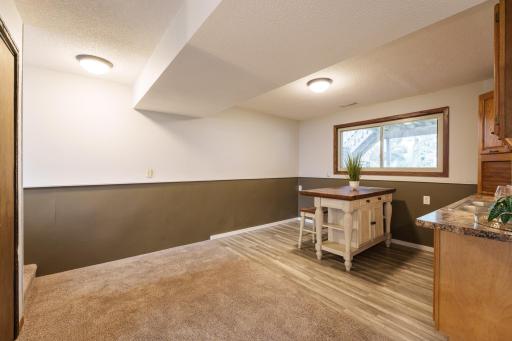 The lower level adds a second comfortable living space with a family room, wet bar, two additional bedrooms, and a Â¾ bathroom.