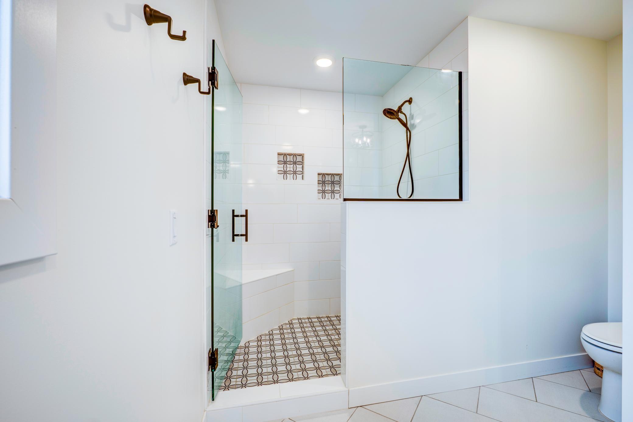 Large tiled walk in shower.
