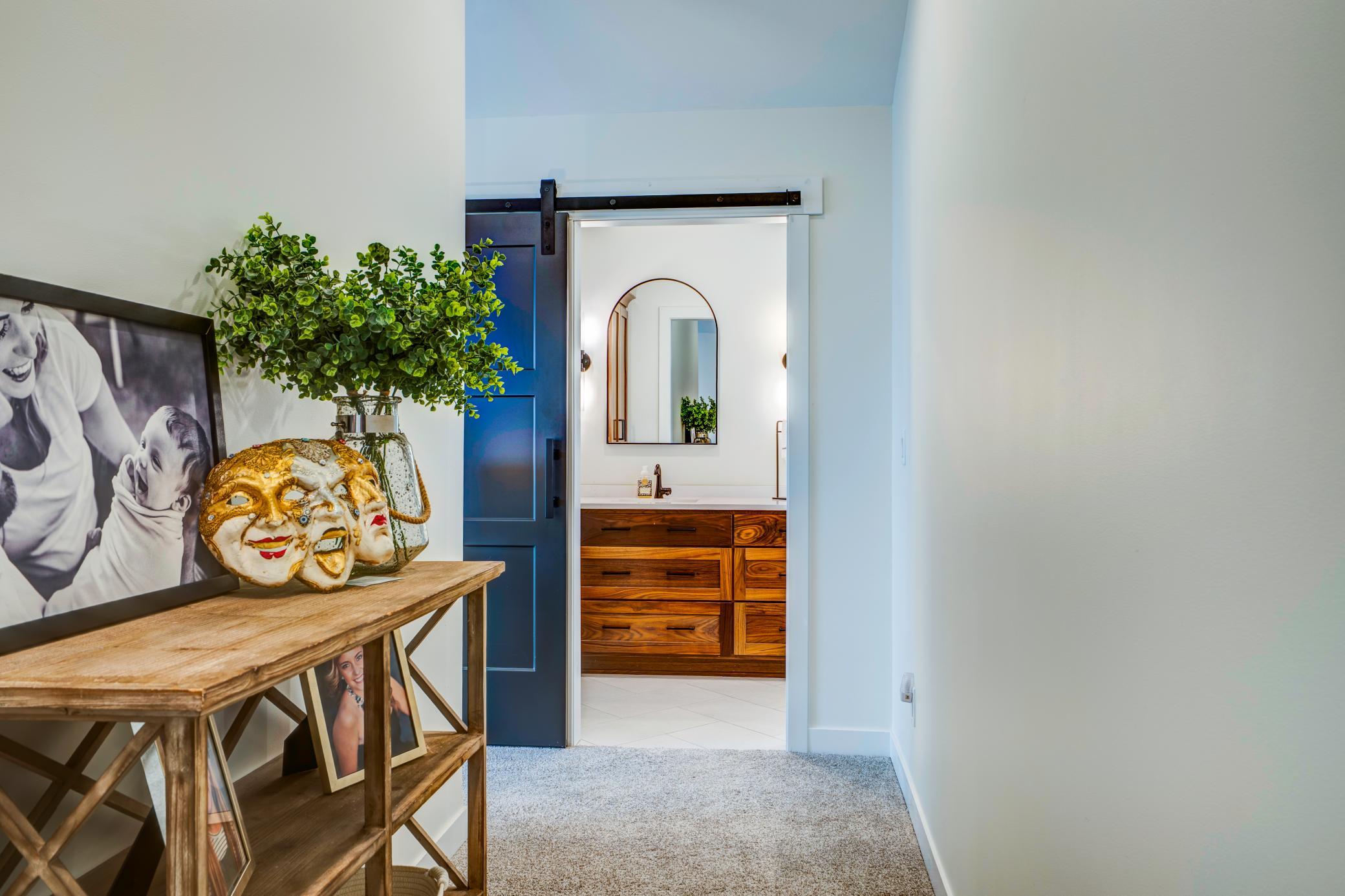 This Hallway located within the primary suite leads to the spa like bathroom