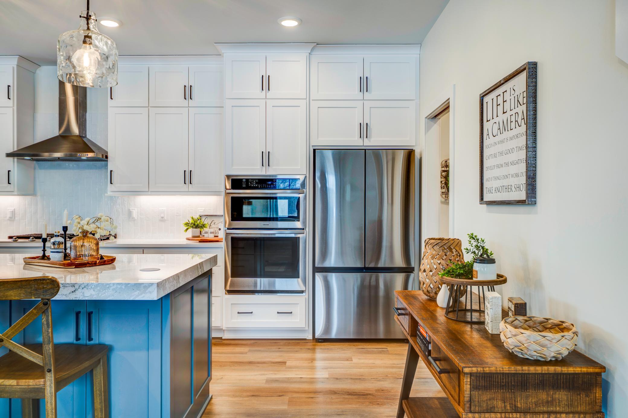 Double wall oven and a stainless appliance package complete the chefs kitchen