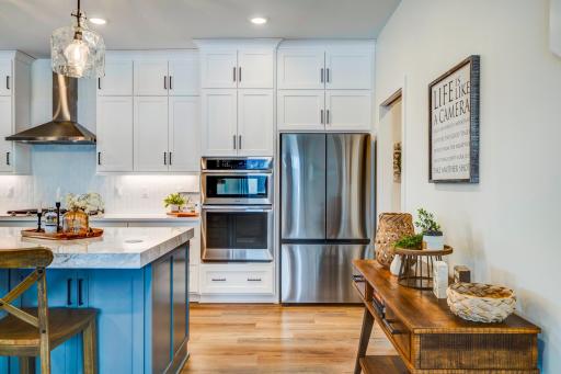Double wall oven and a stainless appliance package complete the chefs kitchen