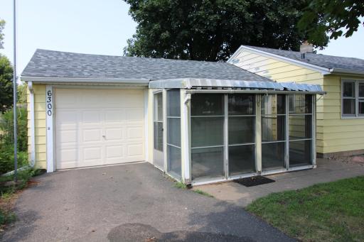 Attached garage and screened porch.