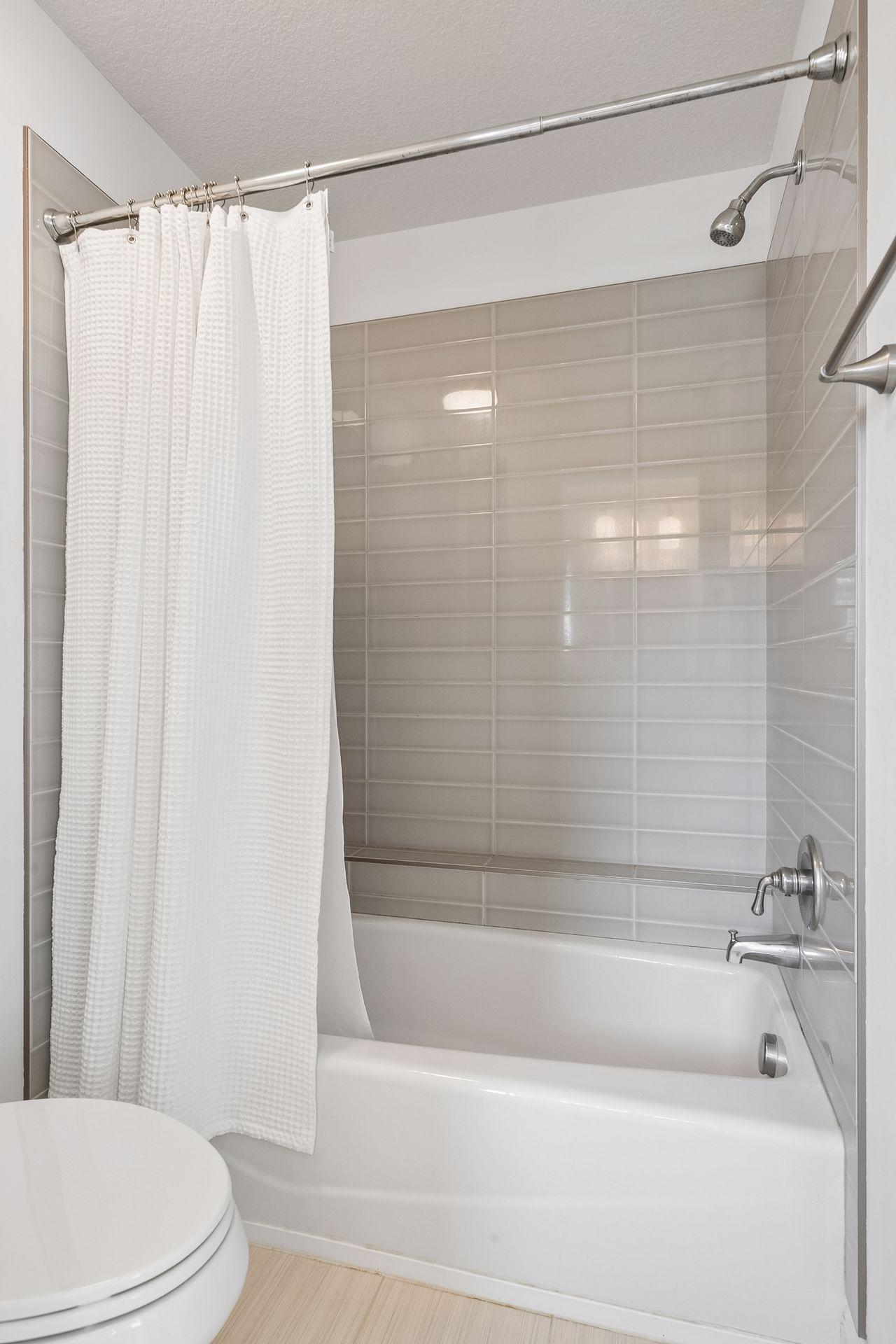 Jack and Jill bath - tiled shower