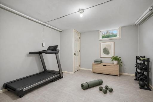 Room between lower level family room and garage could be a perfect gym!