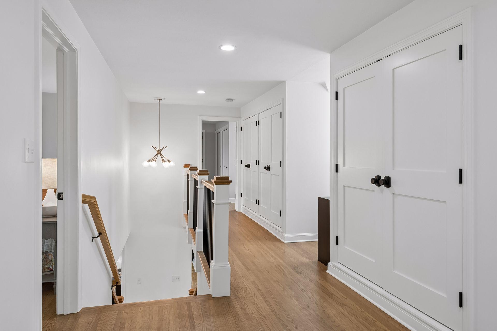 Full wall storage space in upper level hall