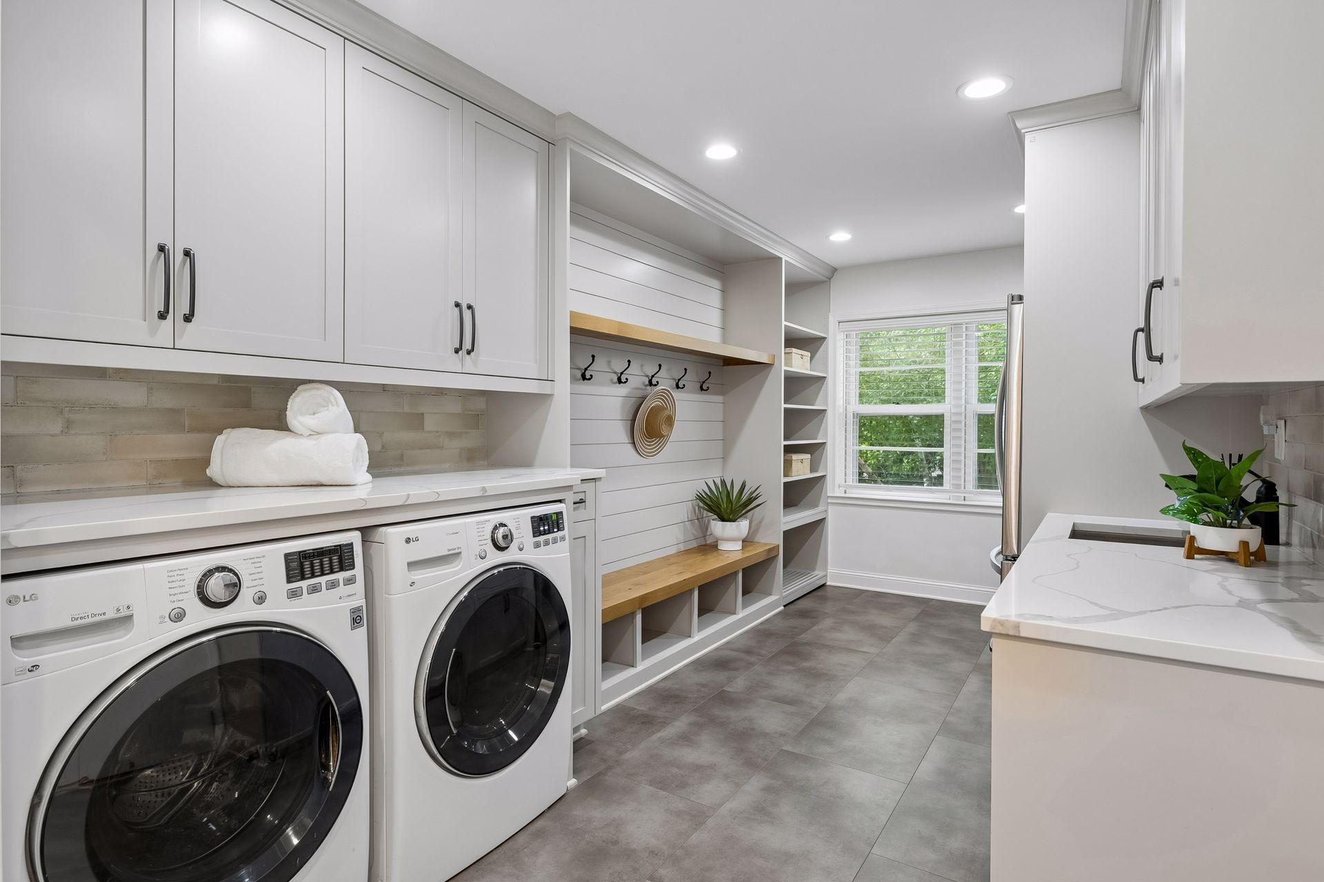 One of two laundry rooms - main level mud room with cubbies and extra refrigerator