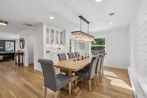 Fantastic formal dining room with new lighting, and comfortable seating for 10. Formal spaces to the front of the home.