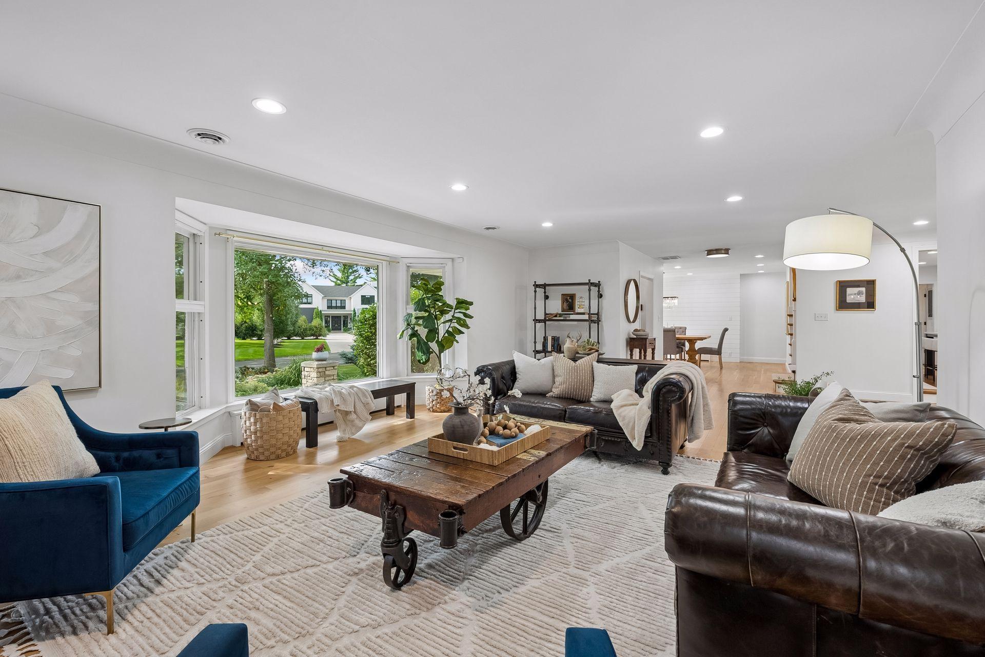 main level living room, new recessed lighting and fireplace wall