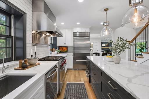 Kitchen renovations include Custom Caninetry and quartz countertops, wide plank White Oak floors, recessed lighting and more.