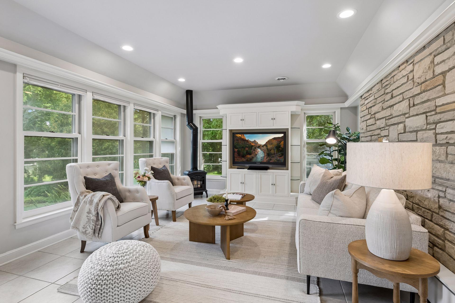 4 season porch/TV room with limestone walls