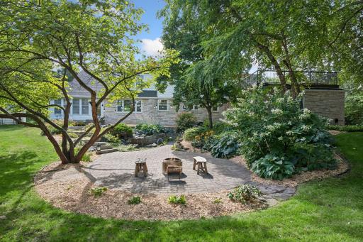 Fire pit? Toasted Marshmellows? wooded and private paver patio with limestone walkways and low voltage lighting make this the perfect backdrop for summer gatherings into the evening.