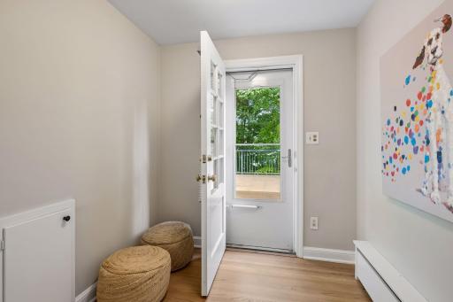 Refinished hardwood floors, fresh paint and new lighting plus walk-out to the 22x22 roof-top deck with top floor views of the wooded yard.