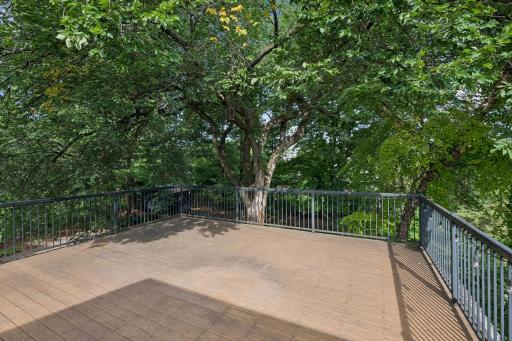 Access the Upper level deck from 2nd floor. Great space for a card night overlooking the wooded yard.