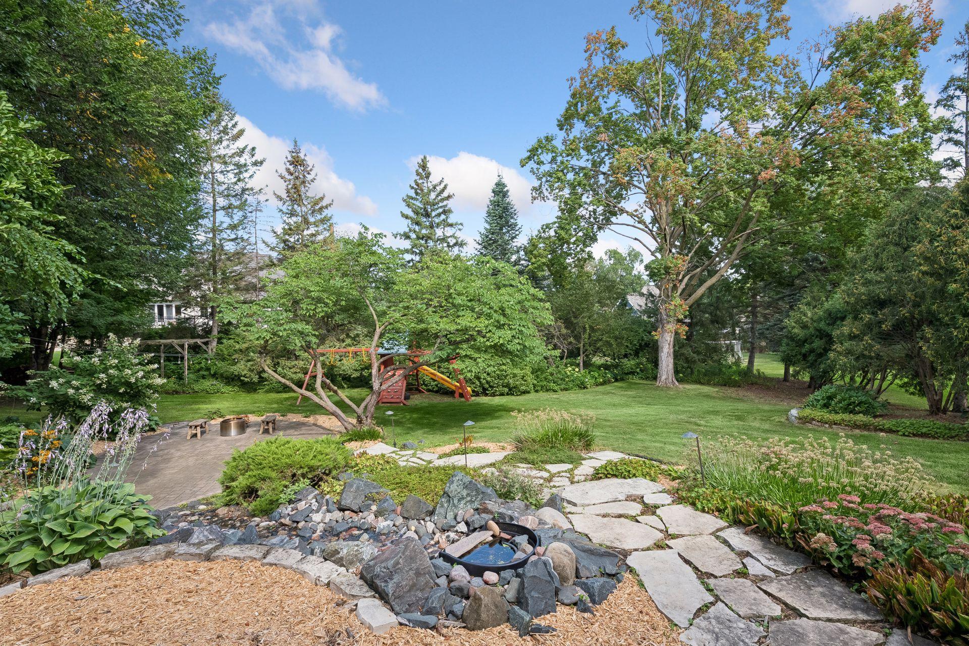 .70 acre lot with paver patio, limestone walk-ways and waterfall.