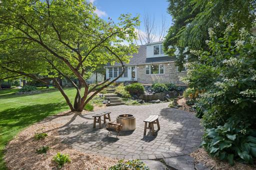 Fire pit, twinkle-lighting, and a hushed waterfall...Wooded and private .70 acre setting.