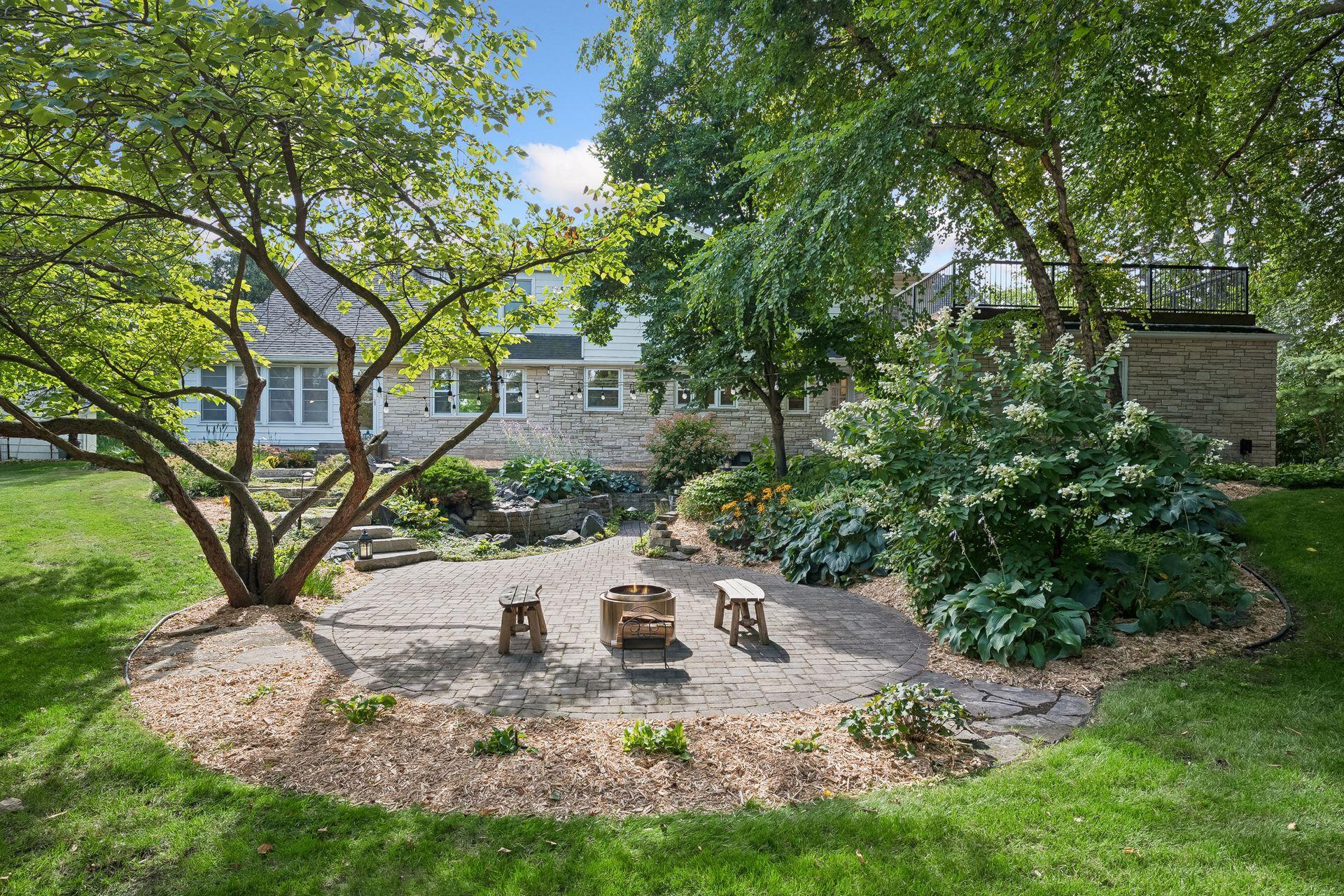 Waterfall...fireplace...this backyard is so relaxing.
