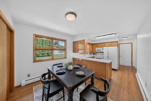 The solid door goes out to the 700sq ft + garage. lots of natural light and great counterspace and overhead lighting.