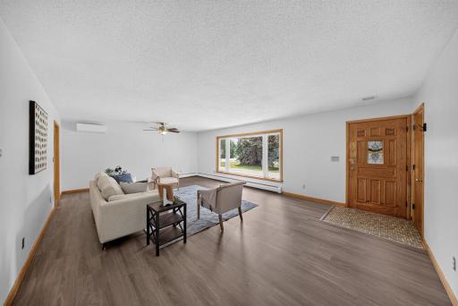 Photo for 401 20th Street SW, Rochester, MN 55902 - listing #7119555 New flooring, large spacious living room with a large front window that lets in lots of natural light. This room is quite large that where the ceiling fan/mini split side is, one could create a large dining room in this room as well.