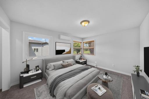 Virtually staged corner back bedroom, where the windows face to the almost 1/2 acre flat lot, again new vinyl window and flooring along with fresh paint.