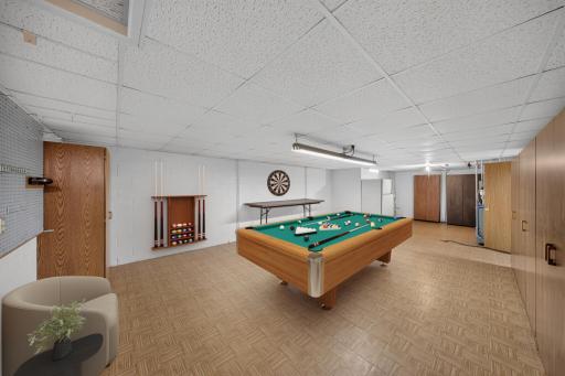 virtually staged as a game room! or could be a workshop inside the home, game room, storage space?This room is located at the bottom of the stairs to the left hand side. The family room is straight from the stairs and laundry to the left.