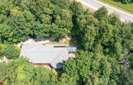 Luxury home nestled among beautiful flower and perennial gardens