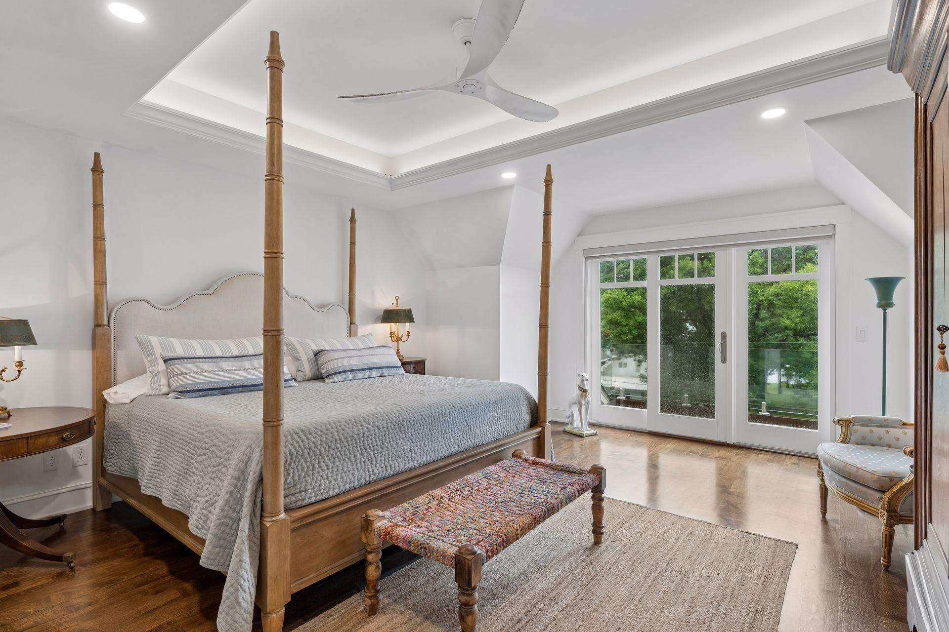primary bedroom with deck on lake side
