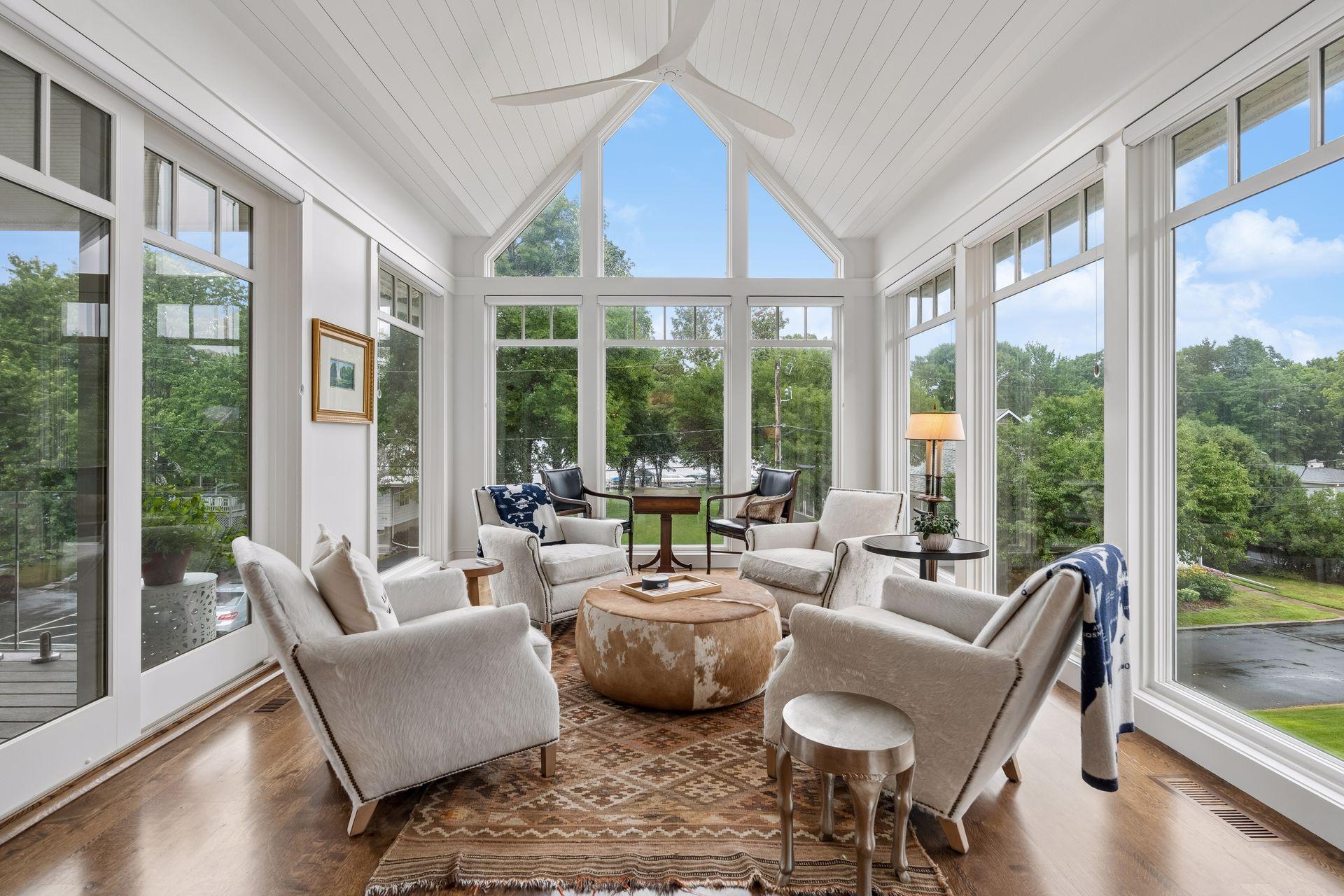 awesome sunroom with lake views and access to private deck
