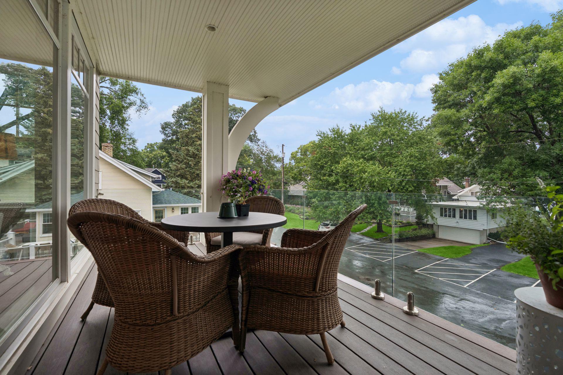 main level deck off of sunroom, composited decking, glass rails for maximum views