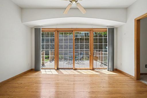 South-facing sunroom with floor-to-ceiling windows and peaceful nature views.