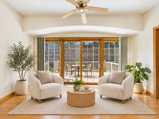 South-facing sunroom and deck access, a strong lifestyle image for natural light and outdoor connection. (virtually staged to show potential)