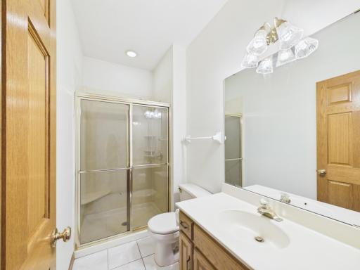 Main-level three-quarter bath adds flexibility for guests and daily routines.