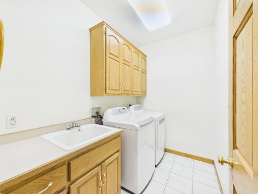 Main-level laundry room adds everyday convenience to the one-level living layout.
