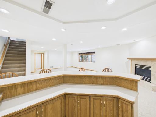 Lower-level wet bar adds convenient serving and gathering space beside the family room.