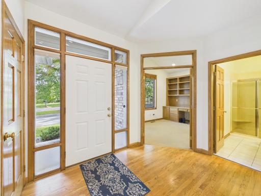 Front entry introduces the main-level layout and brick-front townhome exterior.
