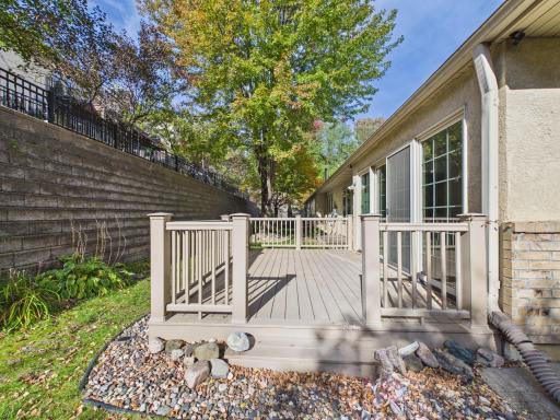 Maintenance-free deck with room to enjoy the mature tree setting.