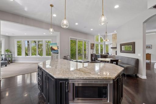 The 10-foot long granite-topped custom island is a great workspace or gathering spot.