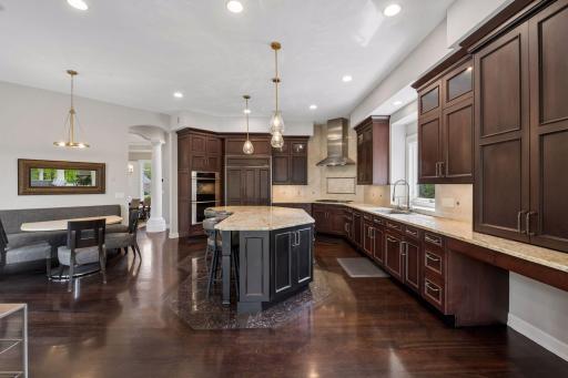 A true chef's kitchen, you'll never want for cabinet space nor counter space here! Wolf, Miele, and Subzero appliances (plus a new Bosch dishwasher), and a huge walk-in pantry (not pictured) are just a few of the perks.