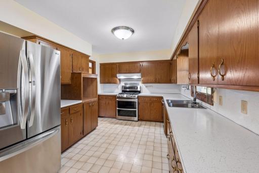 Open kitchen with LG and Bosch stainless appliances