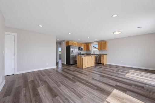 Enjoy the flexibility of the open concept living room, kitchen, and dining area. Durable LVP flooring is featured throughout the home.