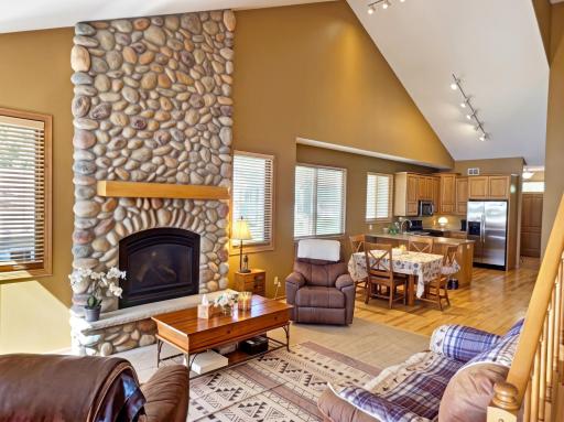 Warm up this fall around this stunning stone hearth gas fireplace. The perfect place to gather with friends and family creating lasting memories.